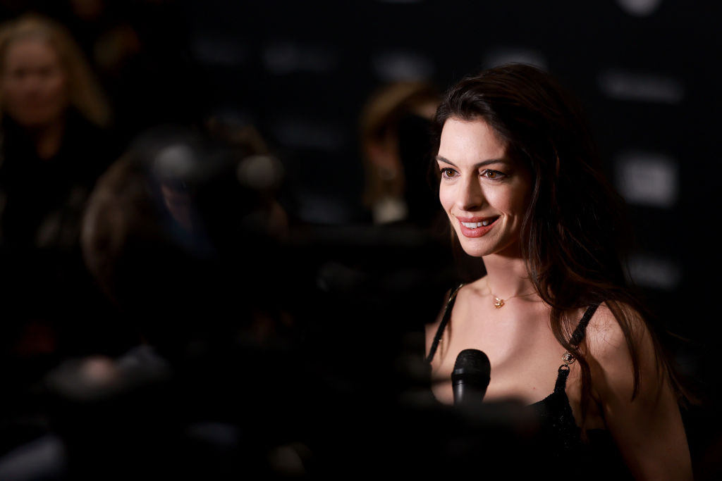 Anne Hathaway Sings Sabrina Carpenter While Urging Voters to Stay in Line