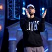 Marshall "Eminem" Mathers claps during the first round of the 2024 NFL Draft at Campus Martius Park and Hart Plaza on April 25, 2024 in Detroit, Michigan.