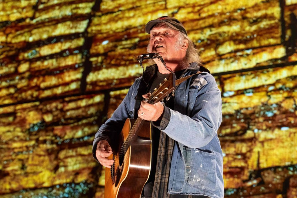 Neil Young changes his mind about withdrawing from Glastonbury after ‘Information Error’