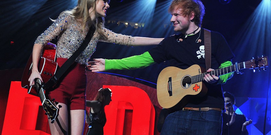 Taylor Swift and Ed Sheeran perform onstage during Z100's Jingle