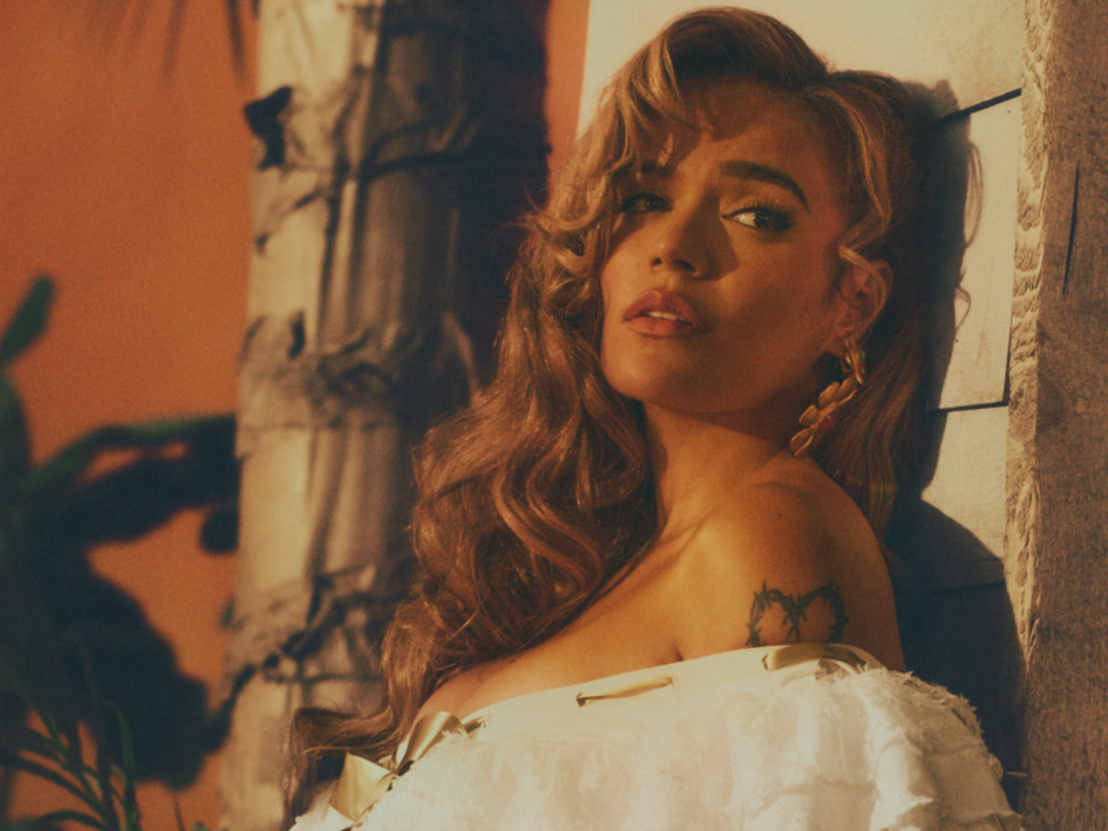 Karol G with Thalía, Feid, and Danny Ramirez during Tropicoqueta era