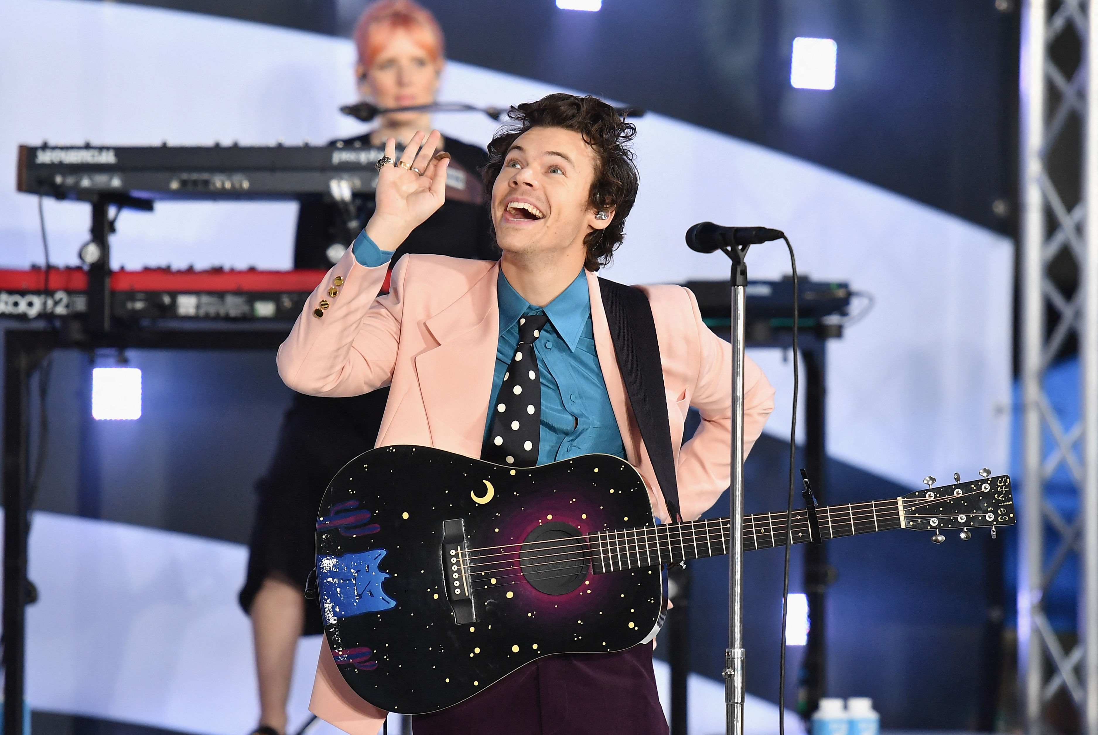 A couple who became engaged during Harry Styles' Madison Square Garden residency appears in his new "Coming Up Roses" video. The song also began as an attempt at a Christmas tune.